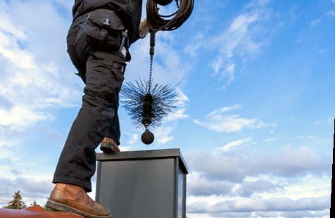 Weighted ball brush lowered into a chase flue